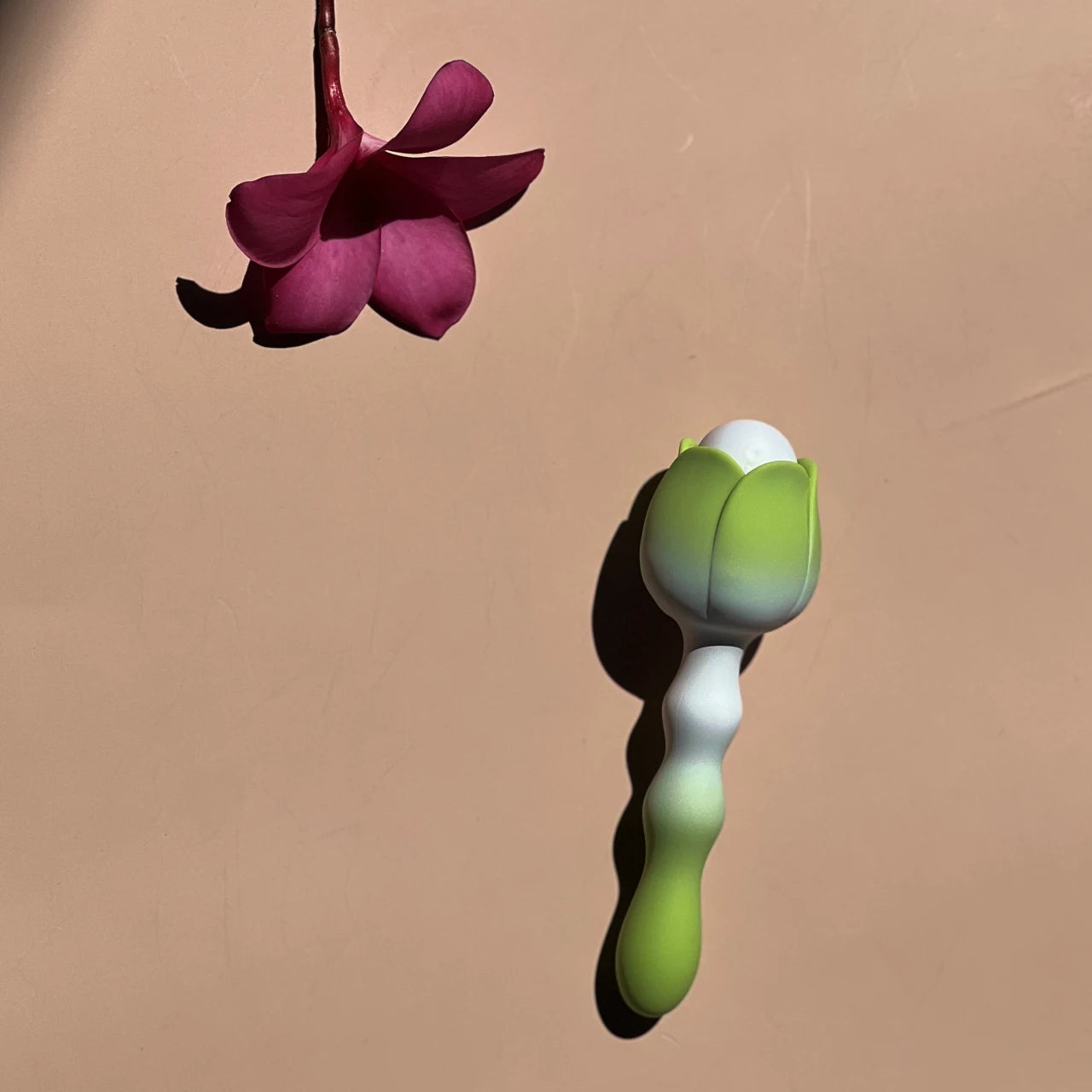 Uoomii Blossom Intimacy Massager held gracefully, designed for comfort and intuitive use during self-care moments